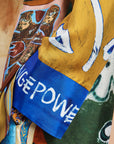Designer printed silk blouse: Close-up of the concealed placket and self-covered buttons on the ALÉMAIS MLAK shirt.