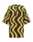Linen mini tunic dress: ALÉMAIS Frankie Mini Dress in a yellow and chocolate wavy stripe print.. LUXAMORE