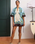 Printed linen summer dress: ALÉMAIS Natalia mini dress showing the deep V-neck line and relaxed dropped shoulders.. LUXAMORE