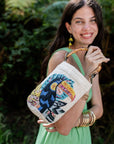 Curaco White Handbag Toucan worn by model in natural setting LUXAMORE