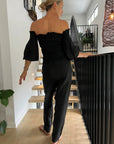 Estilo Emporio Fiorella Top - Black worn by model in natural setting LUXAMORE