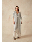 Estilo Emporio La Vista Linen Dress - Binario worn by model in natural setting LUXAMORE