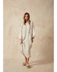 Estilo Emporio Nebbilio Linen Dress - Lyla worn by model in natural setting LUXAMORE
