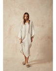 Estilo Emporio Nebbilio Linen Dress - Lyla worn by model in natural setting LUXAMORE