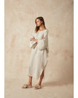 Estilo Emporio Nebbilio Linen Dress - Lyla worn by model in natural setting LUXAMORE