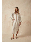Estilo Emporio Nebbilio Linen Dress - Lyla worn by model in natural setting LUXAMORE