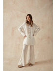 Woman Wearing Estilo Emporio Novo Flare Pant - Brasile Panna White - Pants LUXAMORE