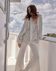 Woman Wearing Estilo Emporio Novo Flare Pant - Brasile Panna White - Pants LUXAMORE