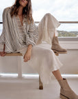 Woman Wearing Estilo Emporio Novo Flare Pant - Brasile Panna White - Pants LUXAMORE