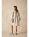 Estilo Emporio Stella Linen Dress - Lyla worn by model in natural setting LUXAMORE