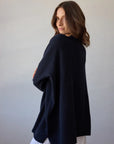 Estilo Emporio Zoe Cashmere - Navy sustainable knit worn by model in studio LUXAMORE