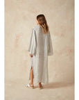 Estilo Emporio Zorba Maxi Linen Dress worn by model in natural setting LUXAMORE