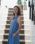 Linen Dress Made in Italy: Sleeveless Boat Neck Maxi Blue worn by model in natural setting LUXAMORE