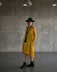 Linen Dress Midi A Line Pockets Made in Italy Yellow worn by model in natural setting LUXAMORE