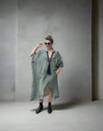 Linen Dress Oversize Maxi Kaftan Made in Italy Olive worn by model in natural setting LUXAMORE