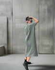 Linen Dress Oversize Maxi Kaftan Made in Italy Olive worn by model in natural setting LUXAMORE