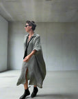 Linen Dress Oversize Maxi Kaftan Made in Italy Olive worn by model in natural setting LUXAMORE