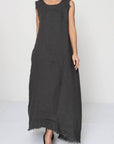 Pre Order Linen Dress Sleeveless Raw Edge, Maxi Made in Italy Black worn by model in natural setting LUXAMORE