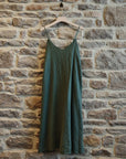 Linen Slip Dress Midi Made in Italy Khaki worn by model in natural setting LUXAMORE