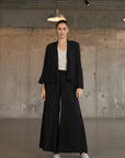 Italian Linen Wide Leg Pants Black - Made in Italy worn by model in natural setting LUXAMORE