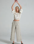 Estilo Emporio Linen Pant Riviera worn by model in natural setting LUXAMORE