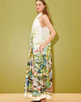 Designer silk dress: ALÉMAIS Jungle Boogie Silk Halter Dress back view showing the button closure and neck self ties.. LUXAMORE