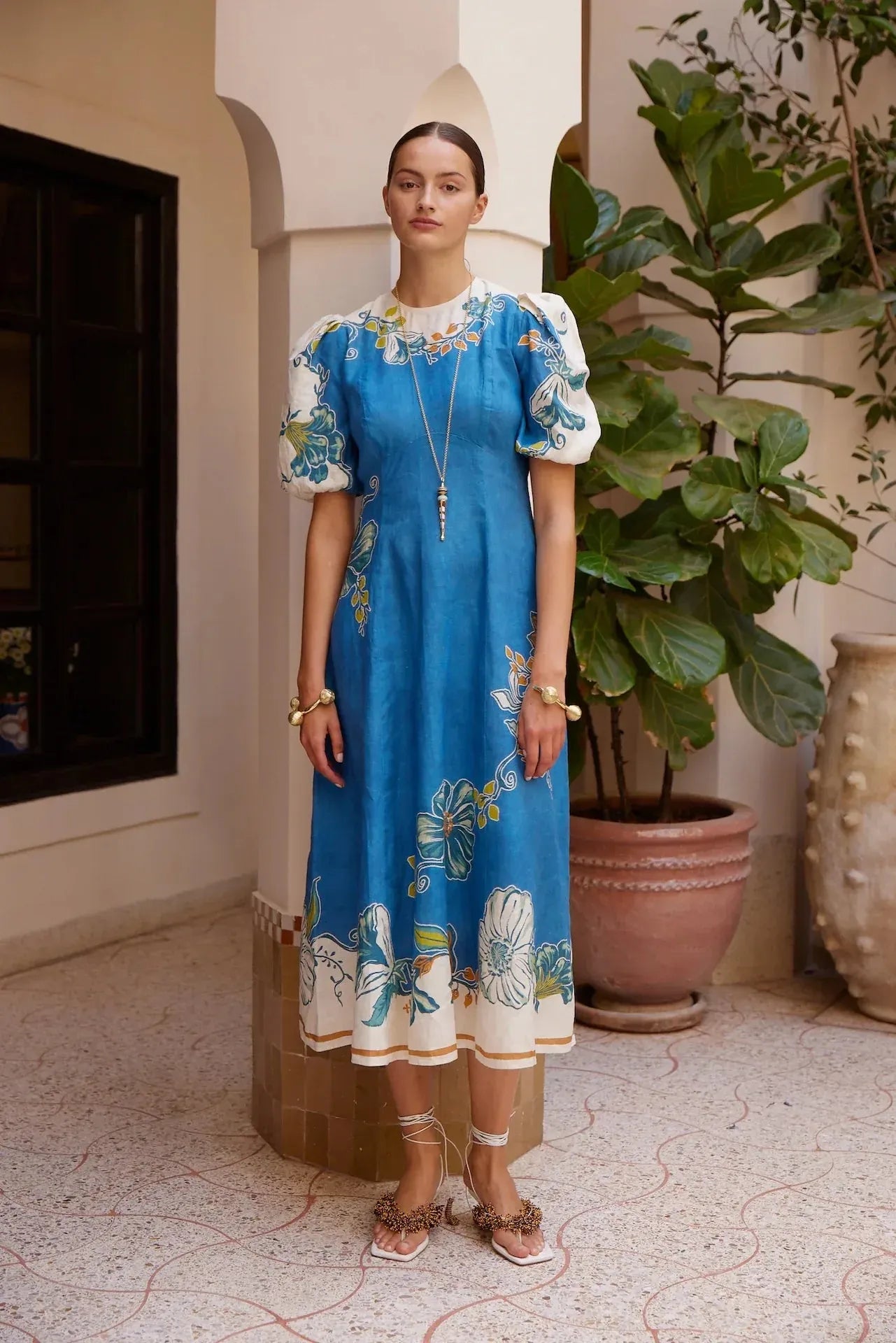 Alemais Luda Midi Dress worn by model in natural setting LUXAMORE 