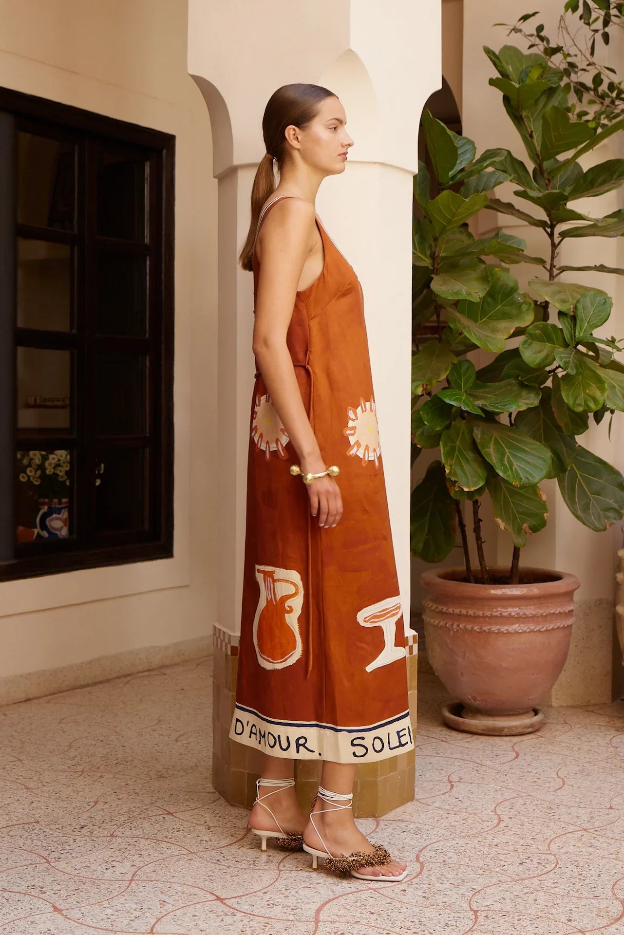 Alemais Soleil D'amour Silk Midi Dress worn by model in natural setting LUXAMORE 