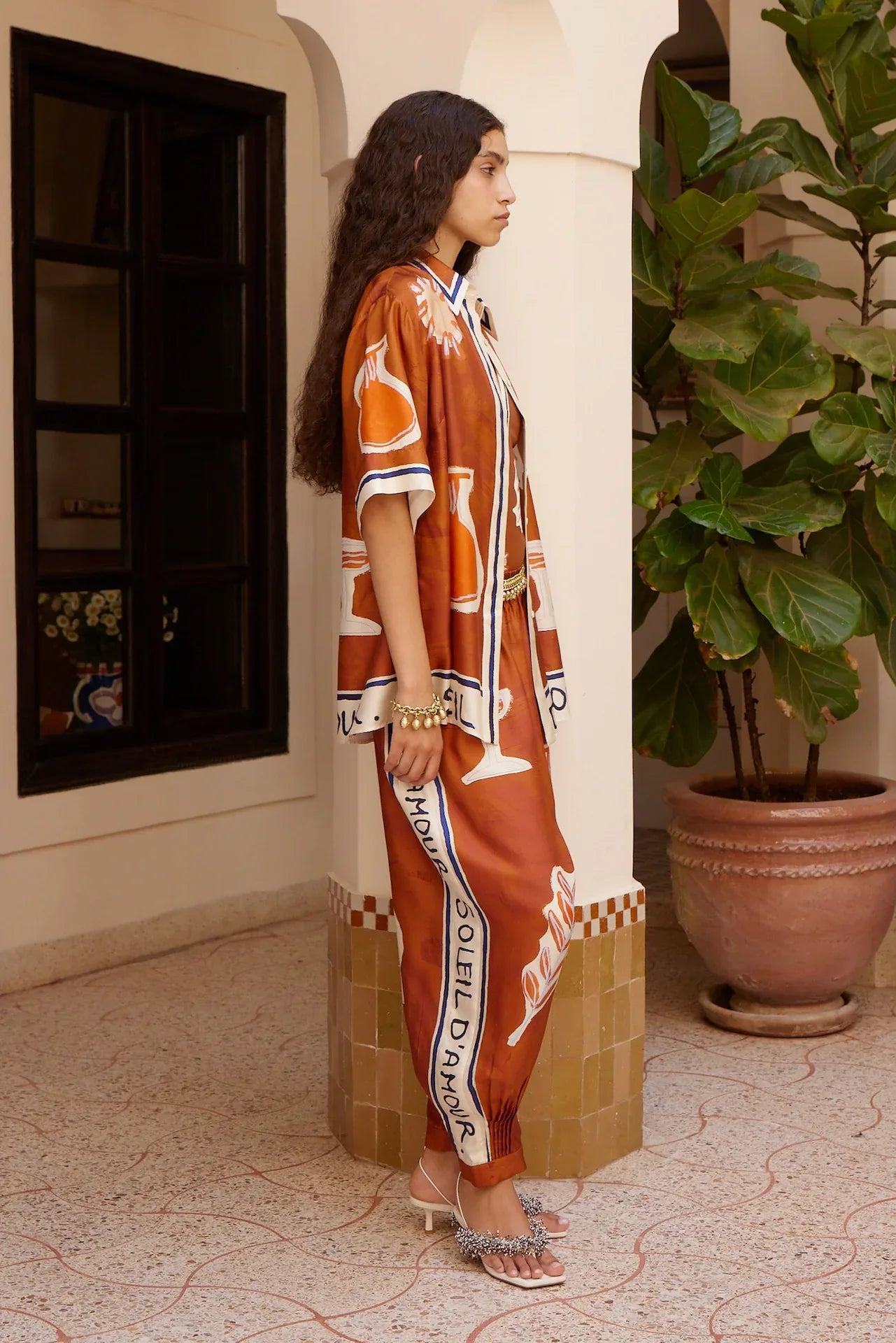 Alemais Soleil d’Amour Silk Shirt worn by model in natural setting LUXAMORE 