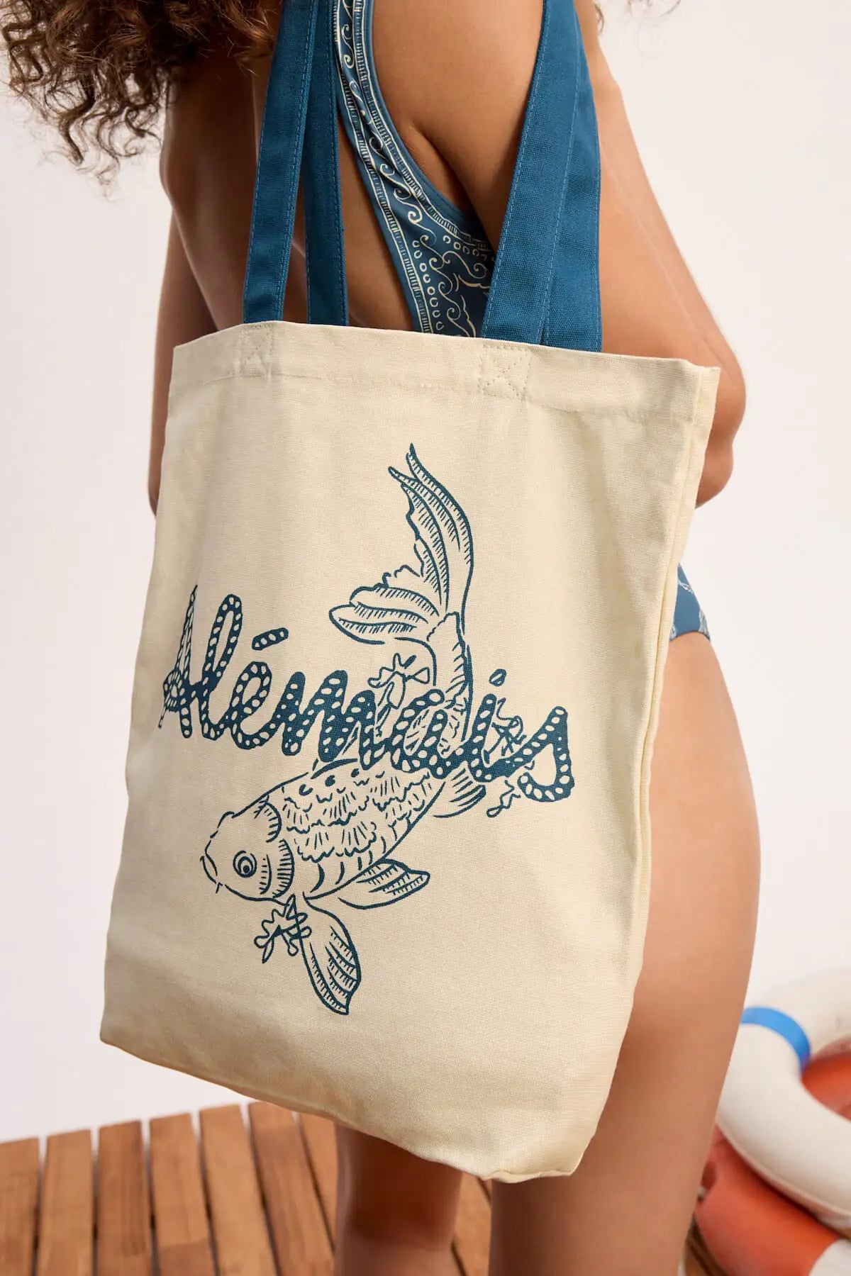 Scuba canvas tote: ALEMAIS Scuba Library Tote bag featuring structured top handles and signature branding.