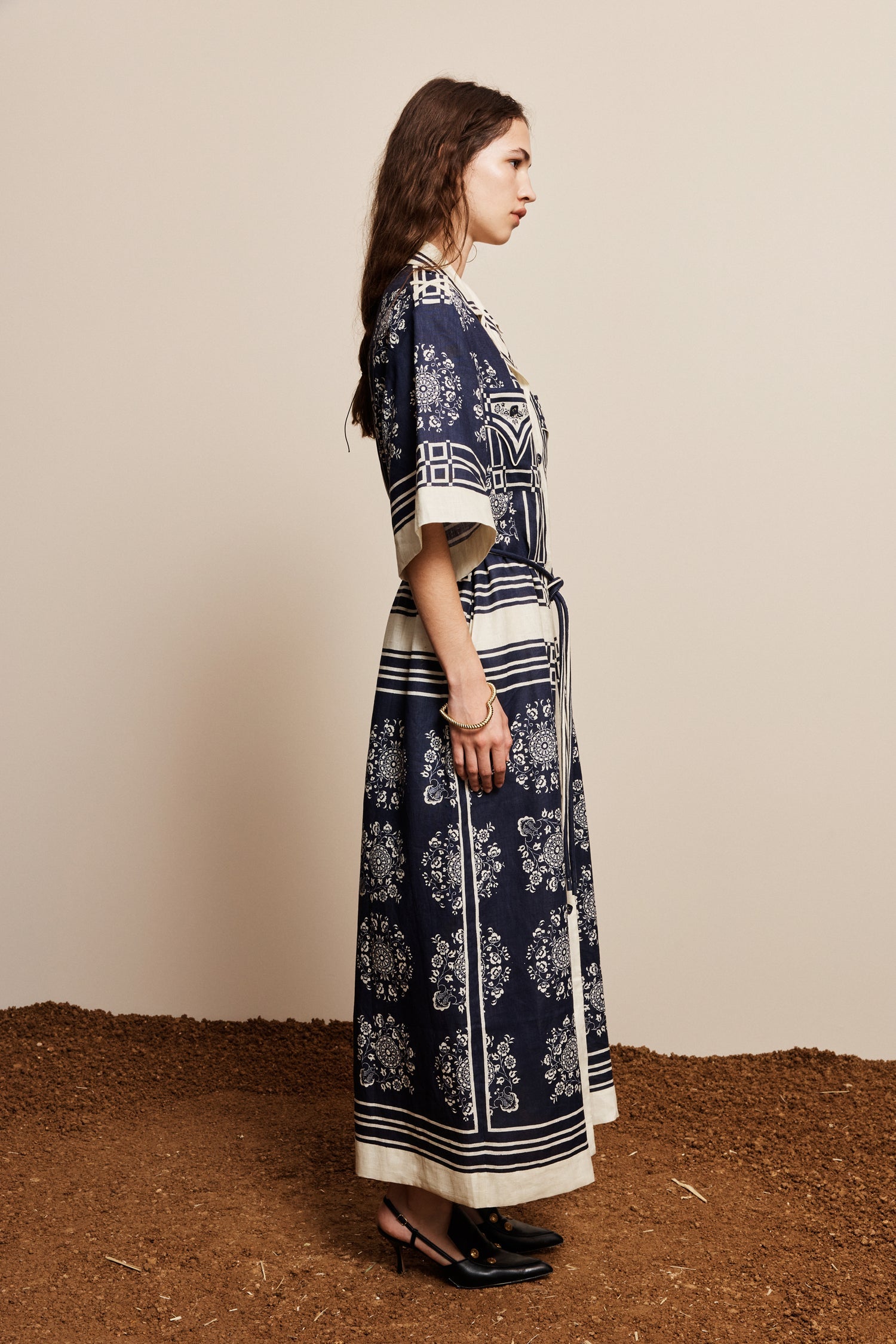 Alemais Sustainable Banderra Linen Shirtdress worn by model side angle LUXAMORE
