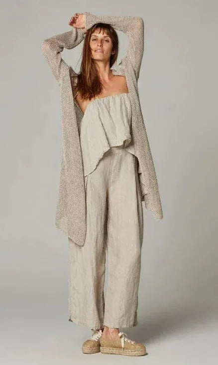 Estillo Emporio Papillion Jumpsuit - Panna White worn by model in natural setting LUXAMORE 
