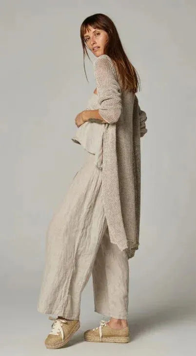 Estillo Emporio Papillion Jumpsuit - Panna White worn by model in natural setting LUXAMORE 