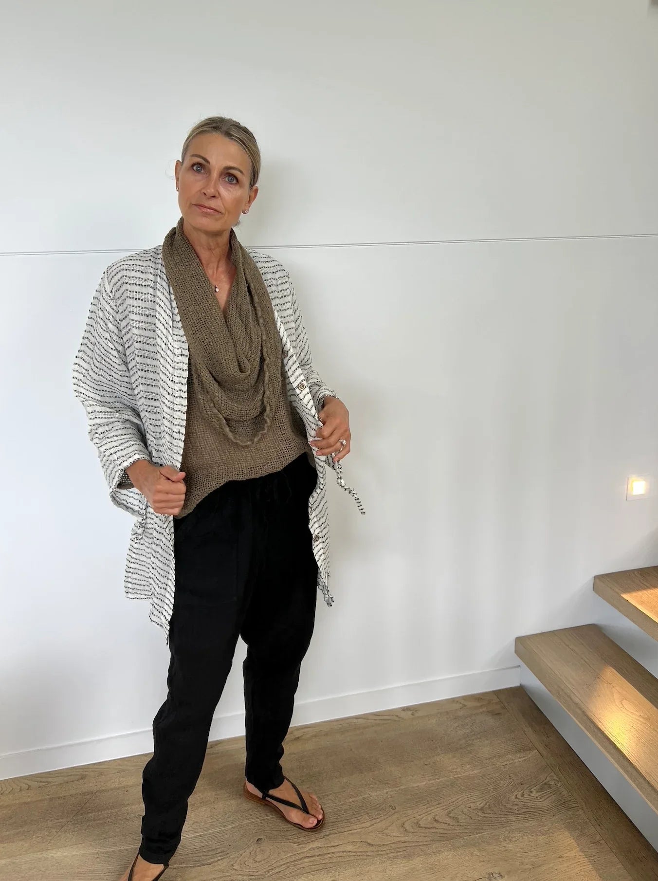 Estilo Emoporio Manta Mini Linen Dress worn by model in natural setting LUXAMORE 