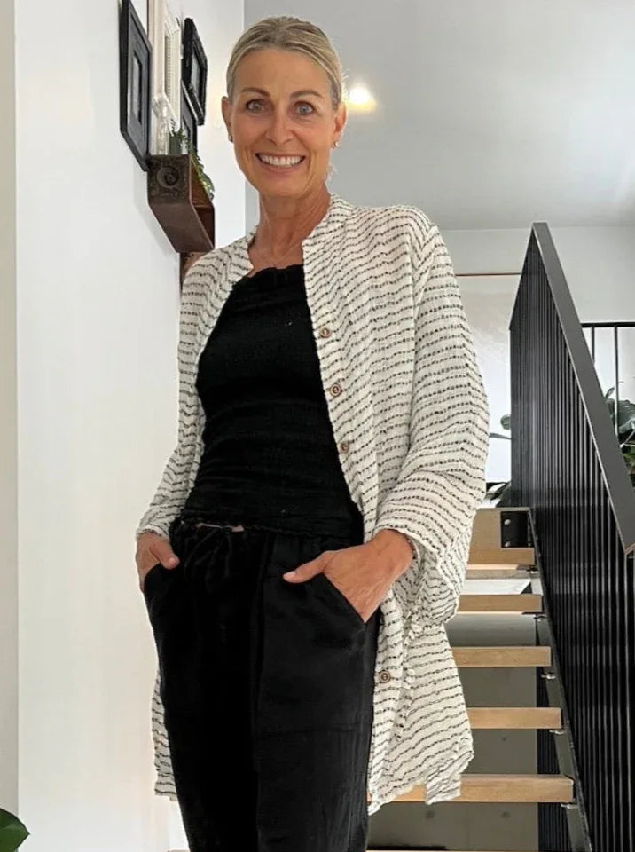 Estilo Emoporio Manta Mini Linen Dress worn by model in natural setting LUXAMORE 