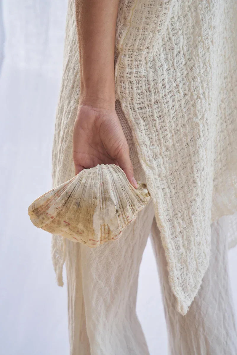 Estilo Emporio Cuadra Top + Dress Cestino Panna worn by model in natural setting LUXAMORE 