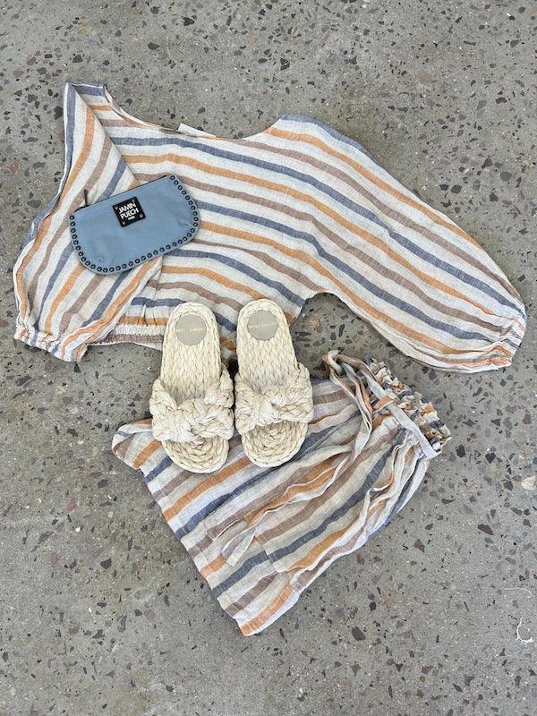 Estilo Emporio Diverti Short worn by model in natural setting LUXAMORE 