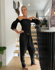 Estilo Emporio Fiorella Top - Black worn by model in natural setting LUXAMORE 