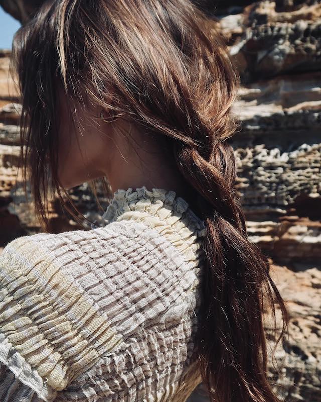 Estilo Emporio Gidget Top worn by model in natural setting LUXAMORE 