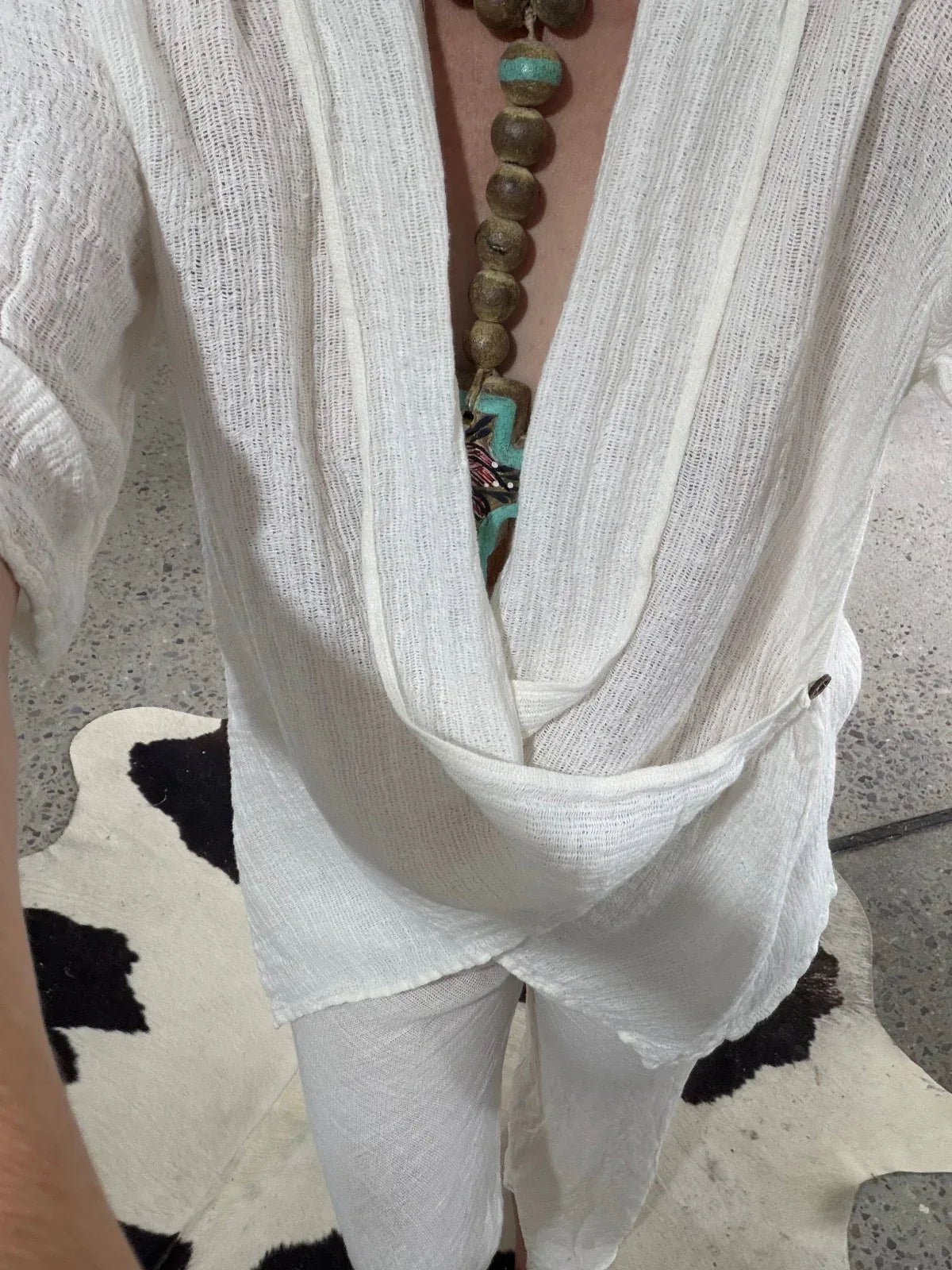 Estilo Emporio Greco Top worn by model in natural setting LUXAMORE 