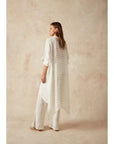 Estilo Emporio La Cota Cover Up Linen Dress worn by model in natural setting LUXAMORE 