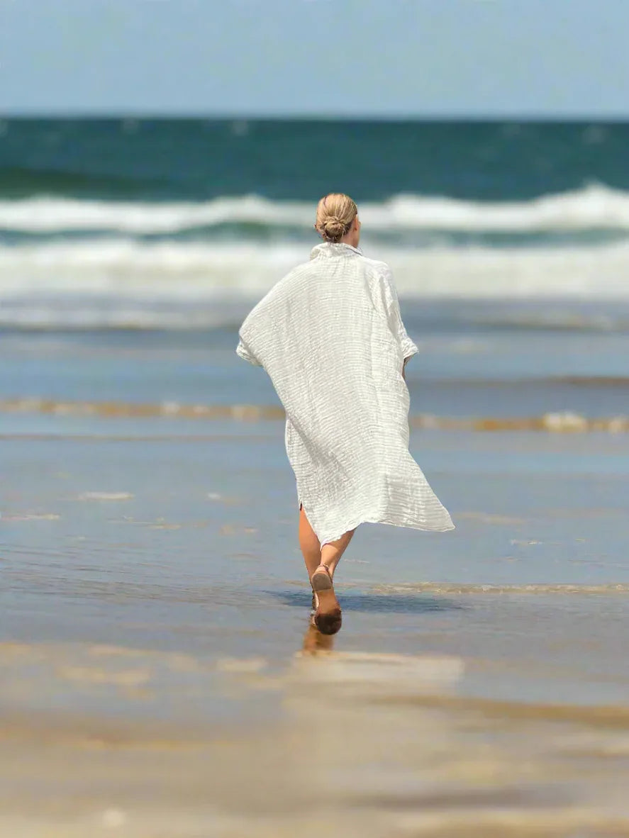 Estilo Emporio La Cota Cover Up Linen Dress Lyla worn by model in natural setting LUXAMORE 