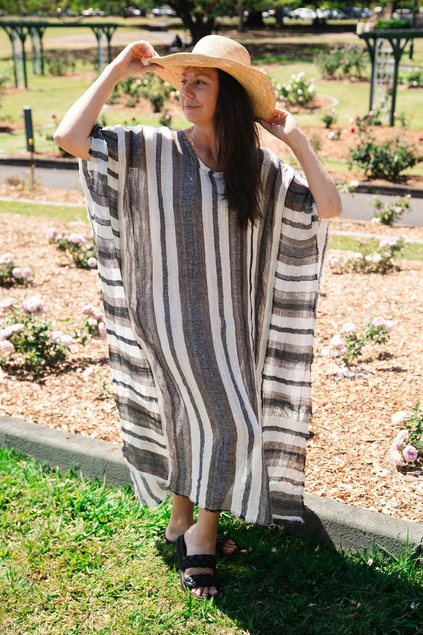 Estilo Emporio Polla Maxi Kaftan Dark Chocolate Stripe worn by model in natural setting LUXAMORE 