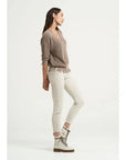 Estilo Emporio Linen Pant Stretch- Natural worn by model in natural setting LUXAMORE 