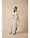 Estilo Emporio Nebbilio Linen Dress - Lyla worn by model in natural setting LUXAMORE 