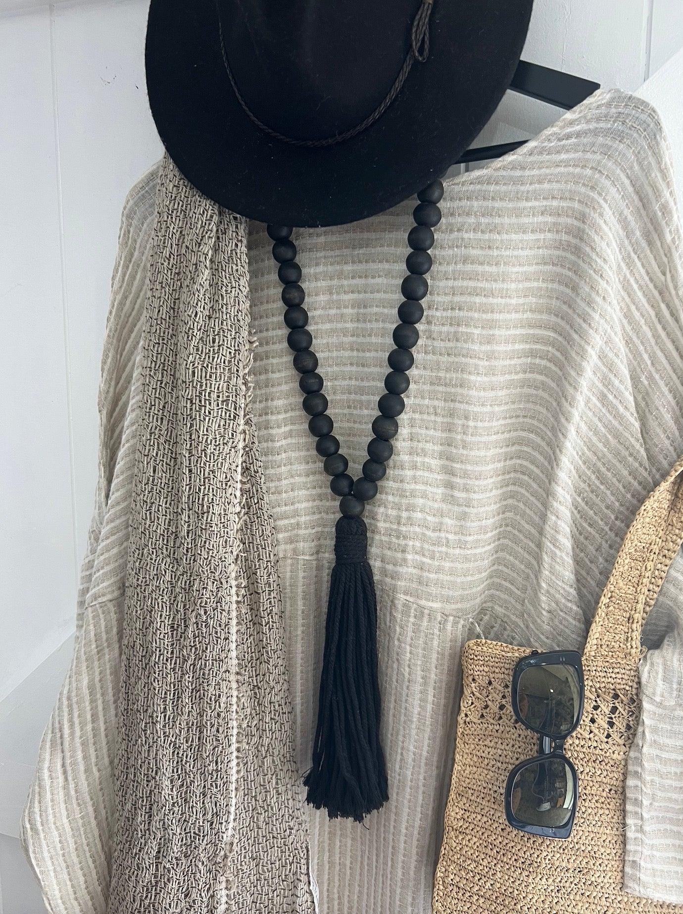 Estilo Emporio Nebbilio Linen Dress - Lyla worn by model in natural setting LUXAMORE 