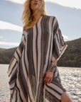 Estilo Emporio Polla Maxi Kaftan Dark Chocolate Stripe worn by model in natural setting LUXAMORE 