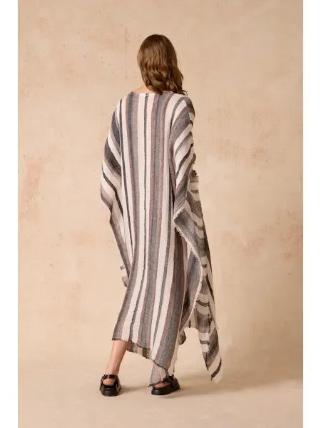 Estilo Emporio Polla Maxi Kaftan Dark Chocolate Stripe worn by model in natural setting LUXAMORE 