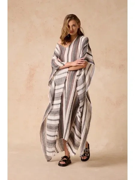 Estilo Emporio Polla Maxi Kaftan Dark Chocolate Stripe worn by model in natural setting LUXAMORE 