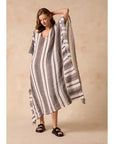 Estilo Emporio Polla Maxi Kaftan Dark Chocolate Stripe worn by model in natural setting LUXAMORE 